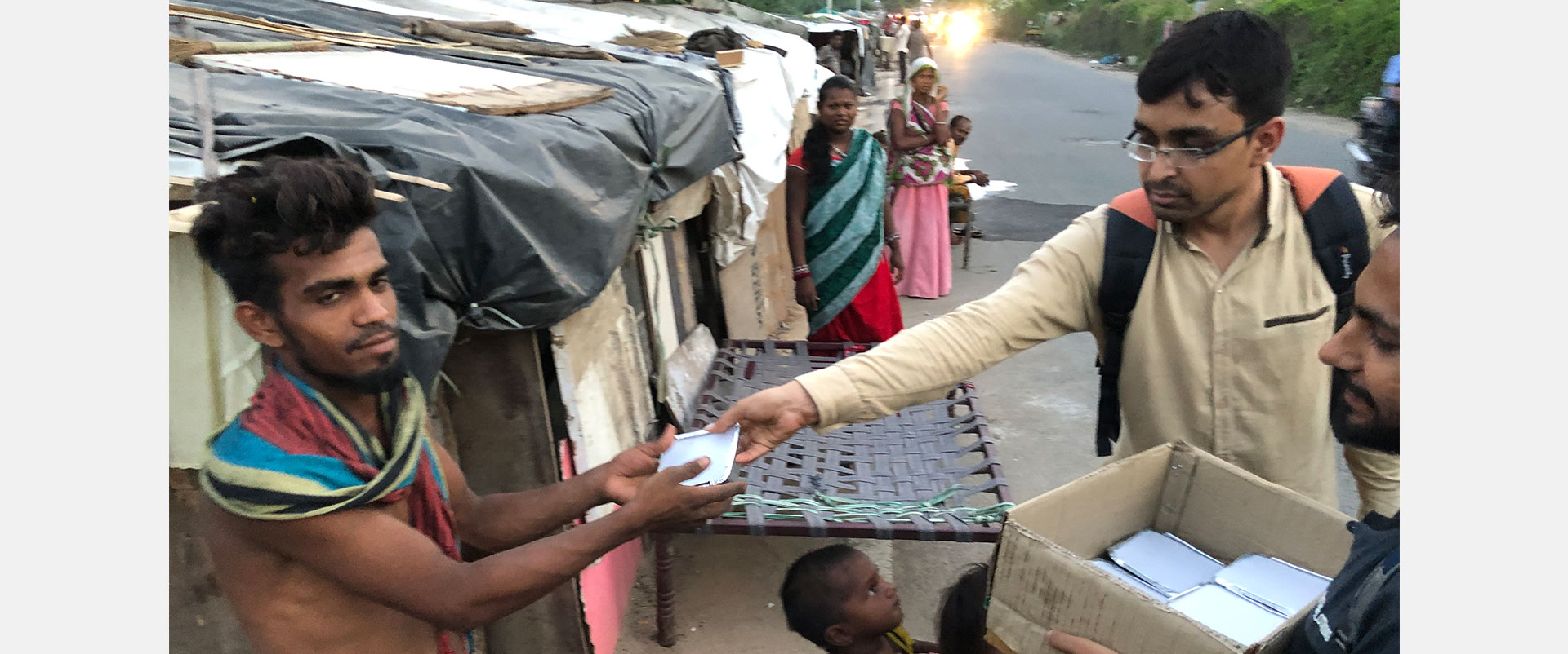 distributing food to homeless family